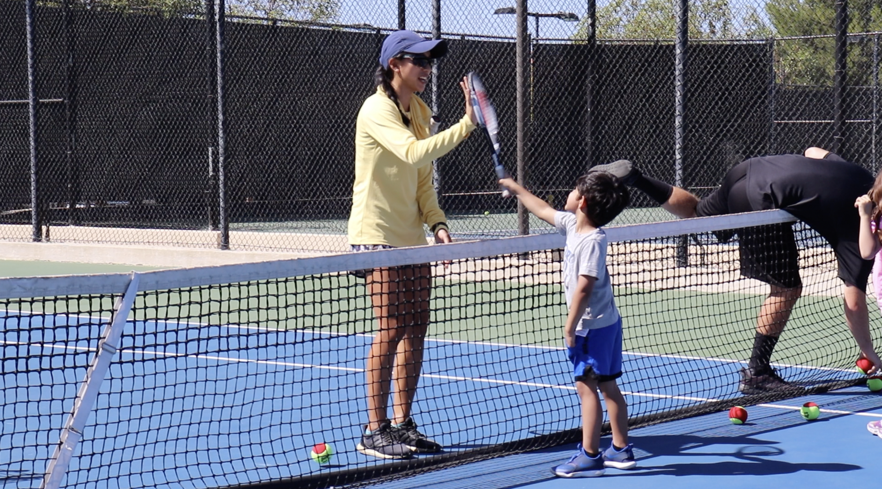 What is the junior tennis program at the Paseo Club?