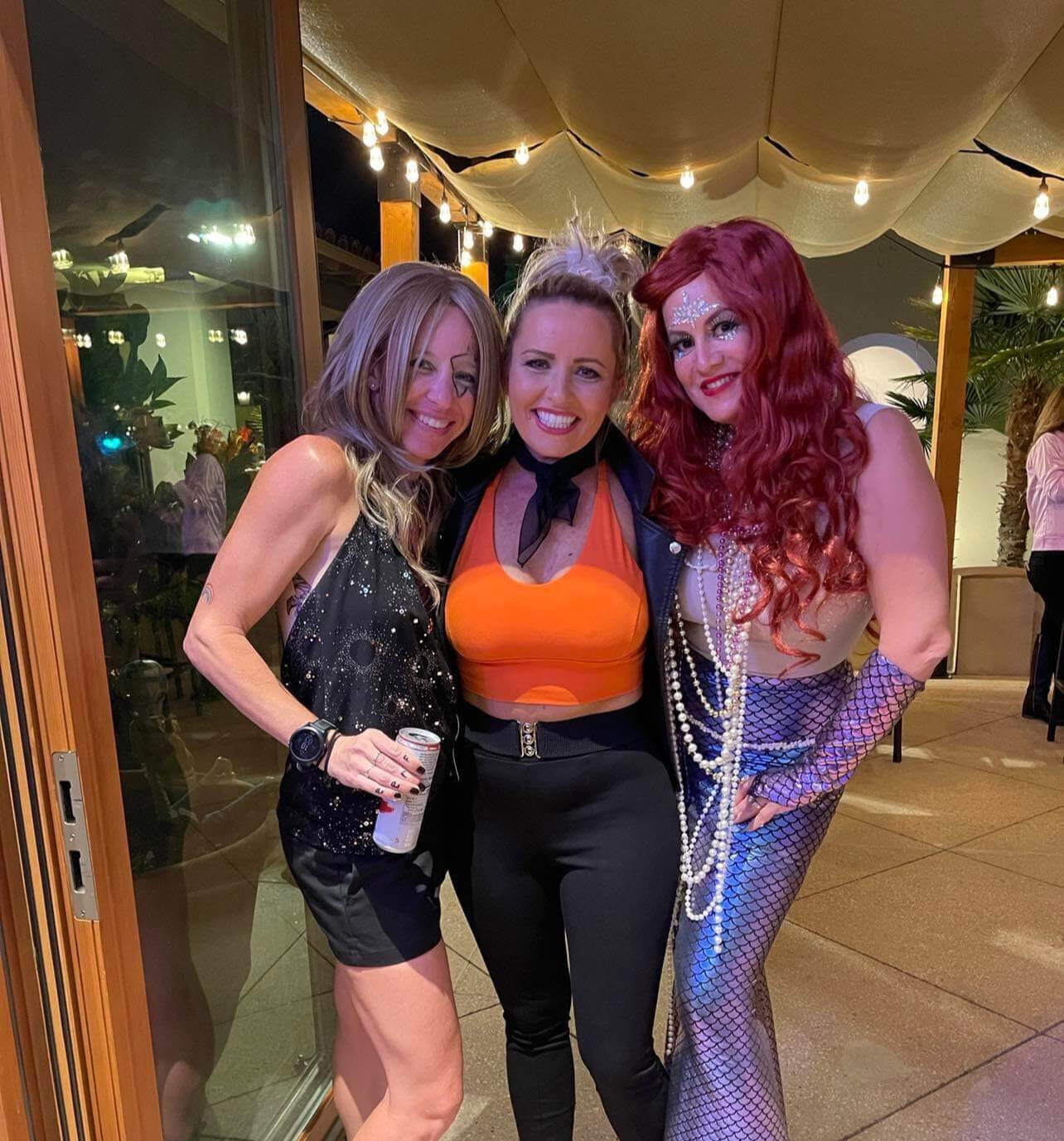 Three women in halloween costumes